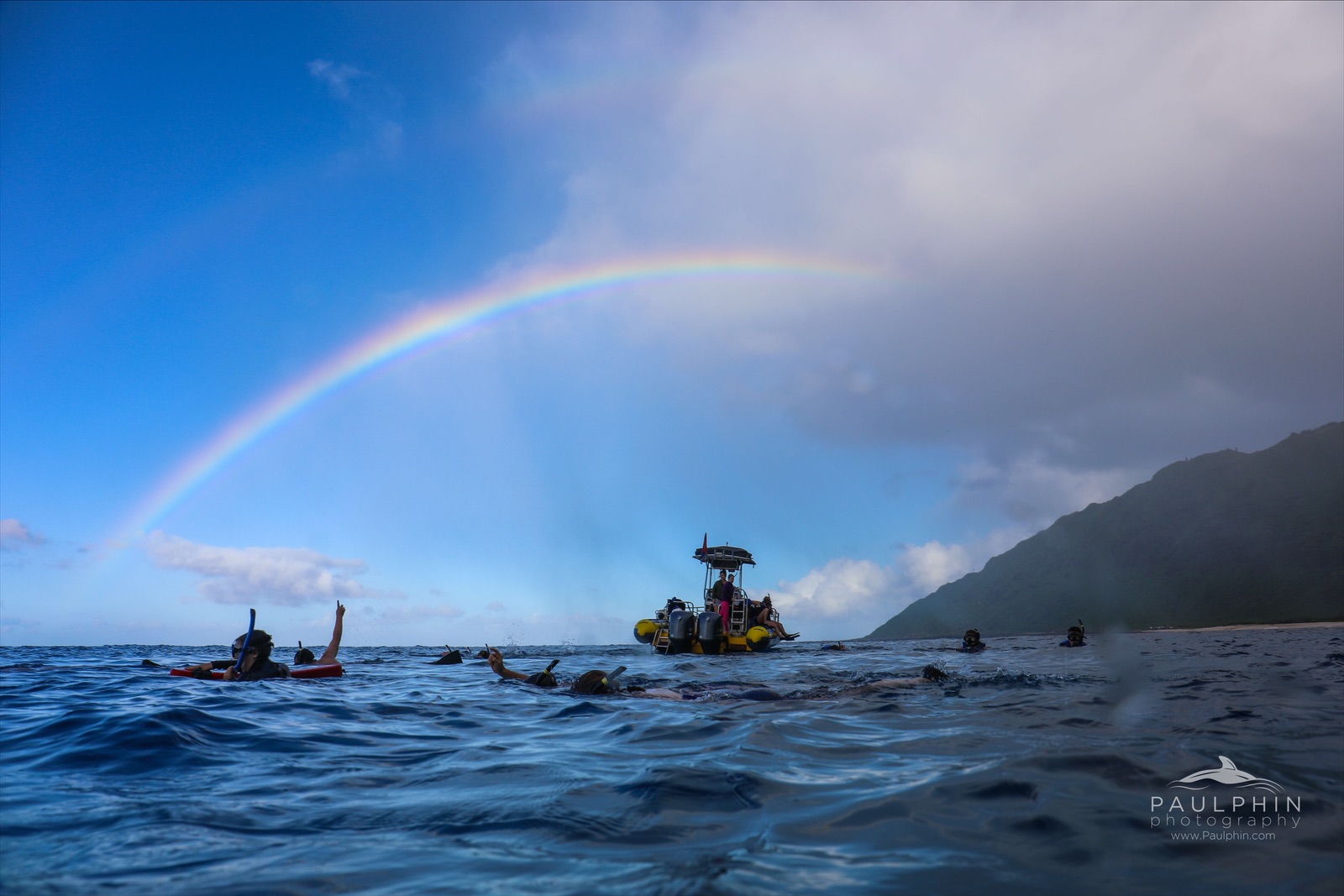 a rainbow over a body of water